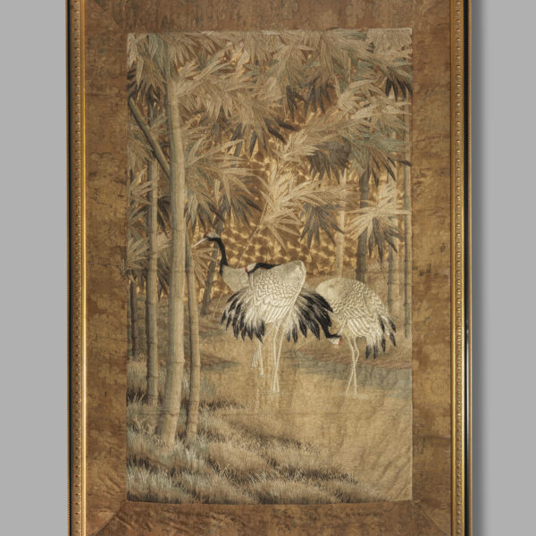 Embroidered wall hanging with cranes amongst bamboo